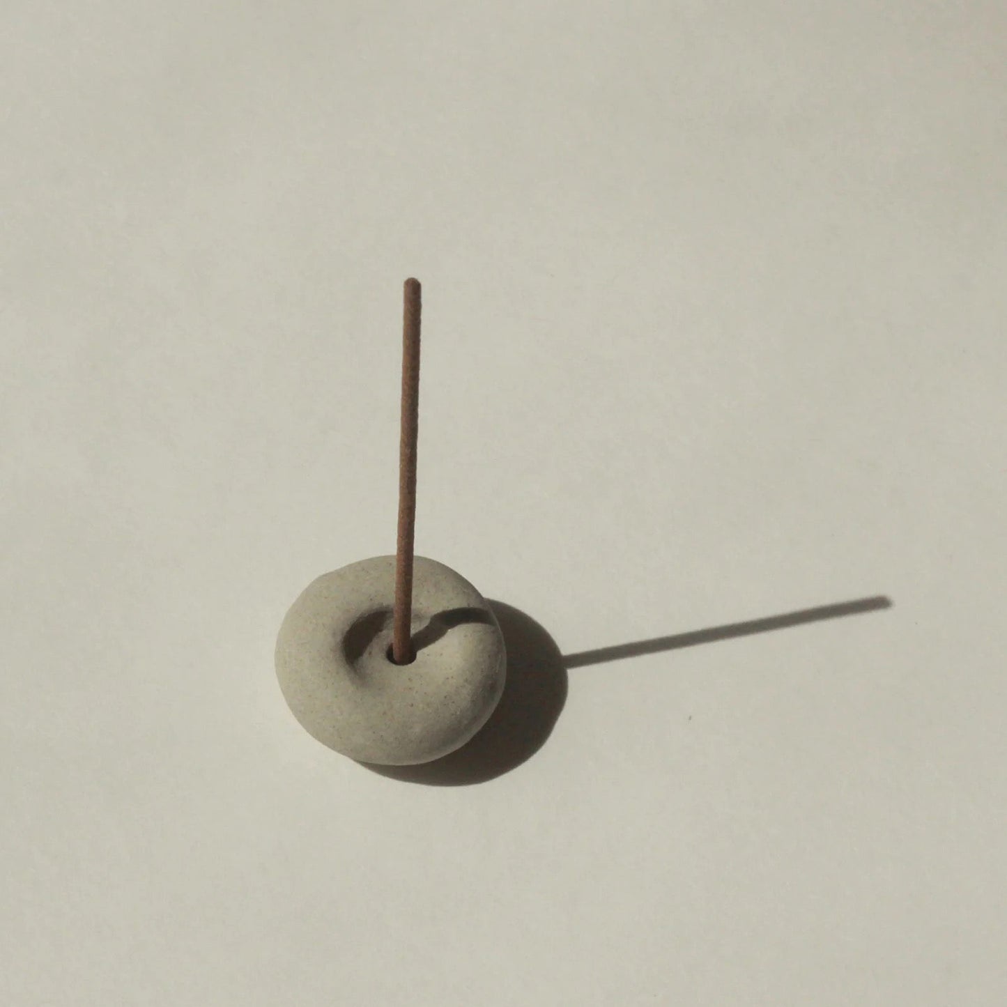 Cedar and Myrrh Mini Light Grey Ceramic Pebble Incense Holder Lifestyle 3